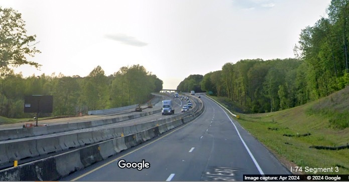 Image of traffic on US 52 North (Future I-74 West) approaching the Westinghouse Road exit using 1/2 of 
        permanent lanes while other half is for current US 52 South traffic, Google Maps Street View, April 2024