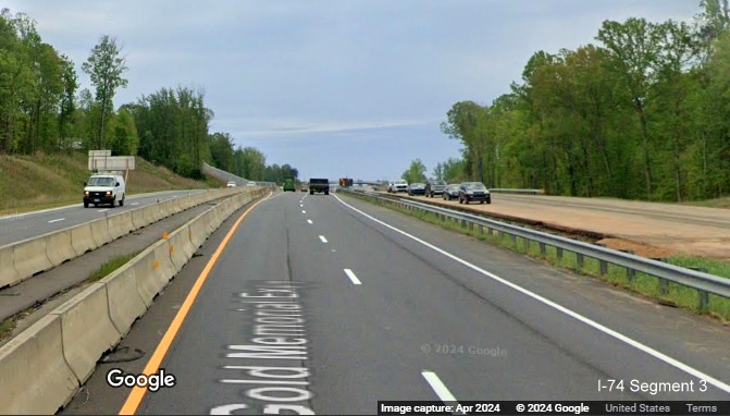 Image of worker cars parked on future US 52 South (I-74 East) lanes prior to the NC 65 
        exit in the Beltway interchange construction zone, Google Maps Street View, April 2024