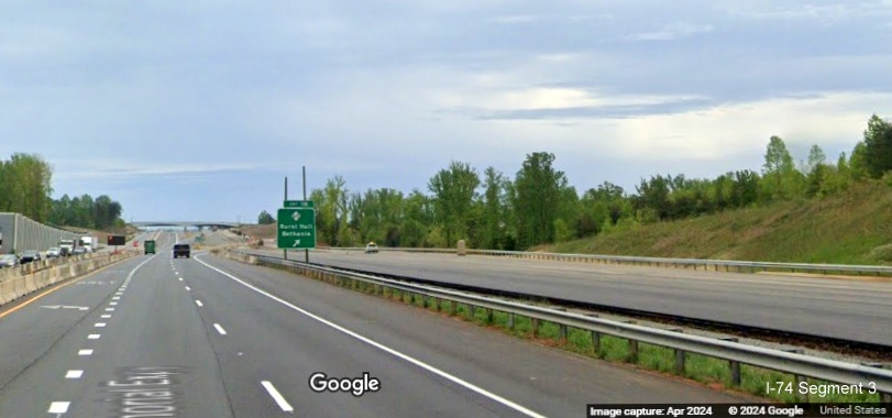 Image of paved future US 52 South (I-74 East) lanes prior to the NC 65 exit in the
        Beltway interchange construction zone, Google Maps Street View, April 2024