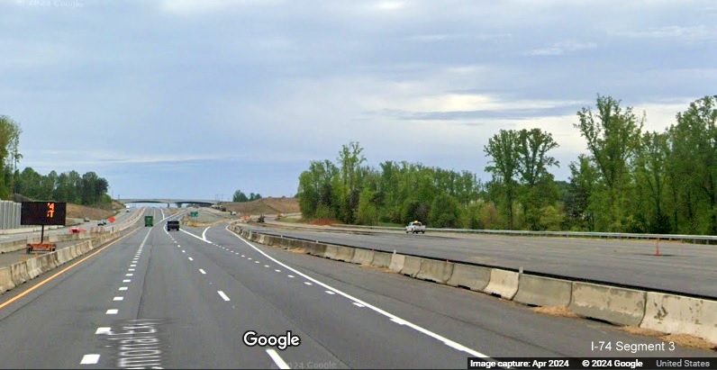 Image of construction along the start of the future ramp for the NC 65 exit in the
        Beltway interchange construction zone, Google Maps Street View, April 2024