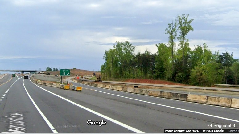 Image of construction on the future NC 65 exit ramp as seen from current US 52 South in the
        Beltway interchange construction zone, Google Maps Street View, April 2024