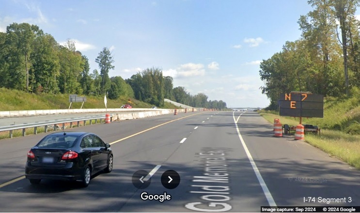 Image of temporary VMS used as 1/2 mile advance sign on the new US 52 South (Future I-74 East) 
        lanes in Rural Hall, Google Maps Street View, September 2024