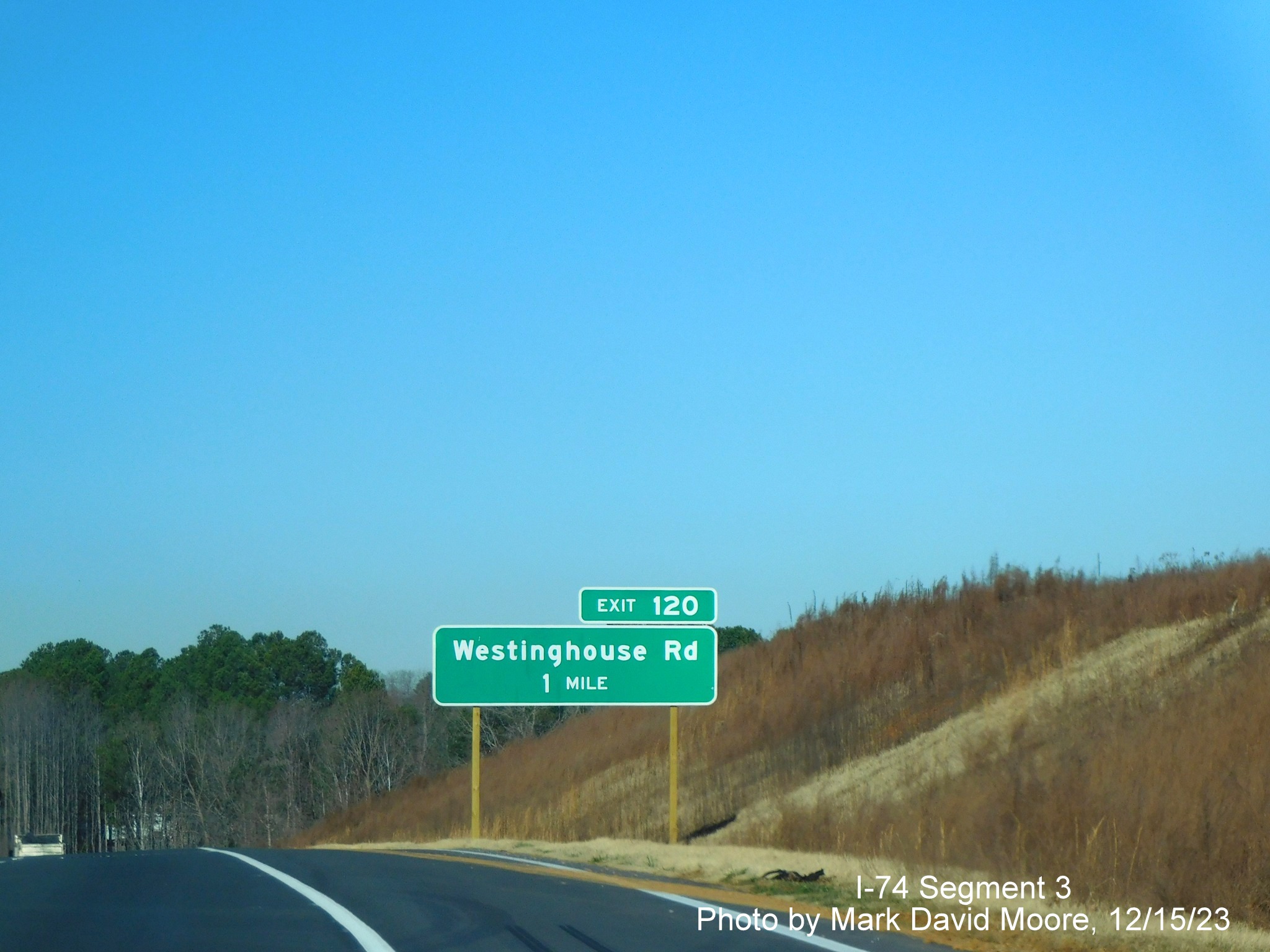 Image of newly placed 1 mile advance sign for the Westinghouse Road exit along the widened 
       portion of US 52 North (Future I-74 West) beyond the Winston-Salem Northern Beltway interchange, by Mark David Moore, December 2023