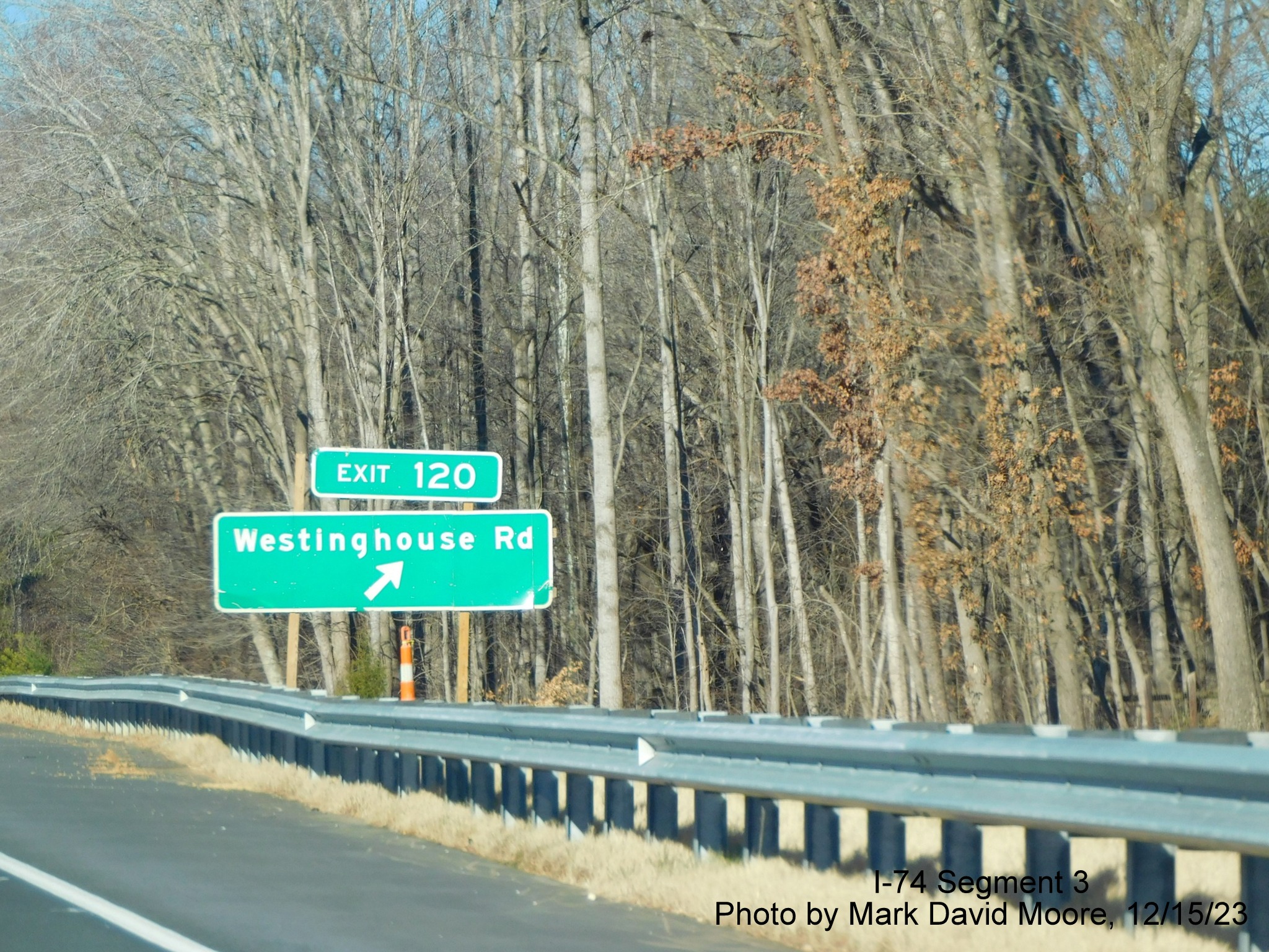 Image of newly placed 1 mile advance sign for the Westinghouse Road exit along the widened 
       portion of US 52 North (Future I-74 West) beyond the Winston-Salem Northern Beltway interchange, by Mark David Moore, December 2023