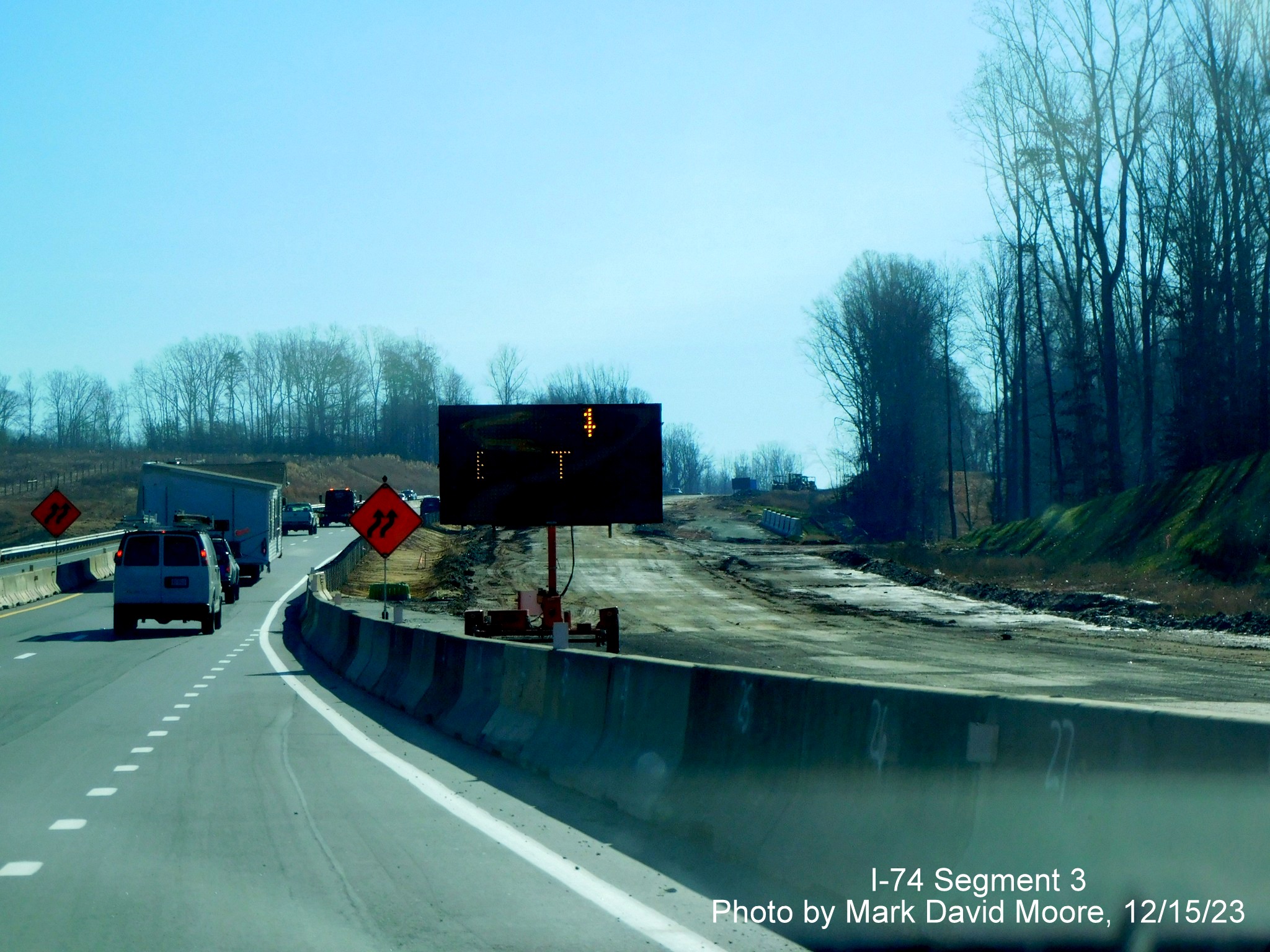 Image of temporary VMS advance sign for completed Winston-Salem Northern Beltway interchange
        after the NC 65 exit, by Mark David Moore, December 2023