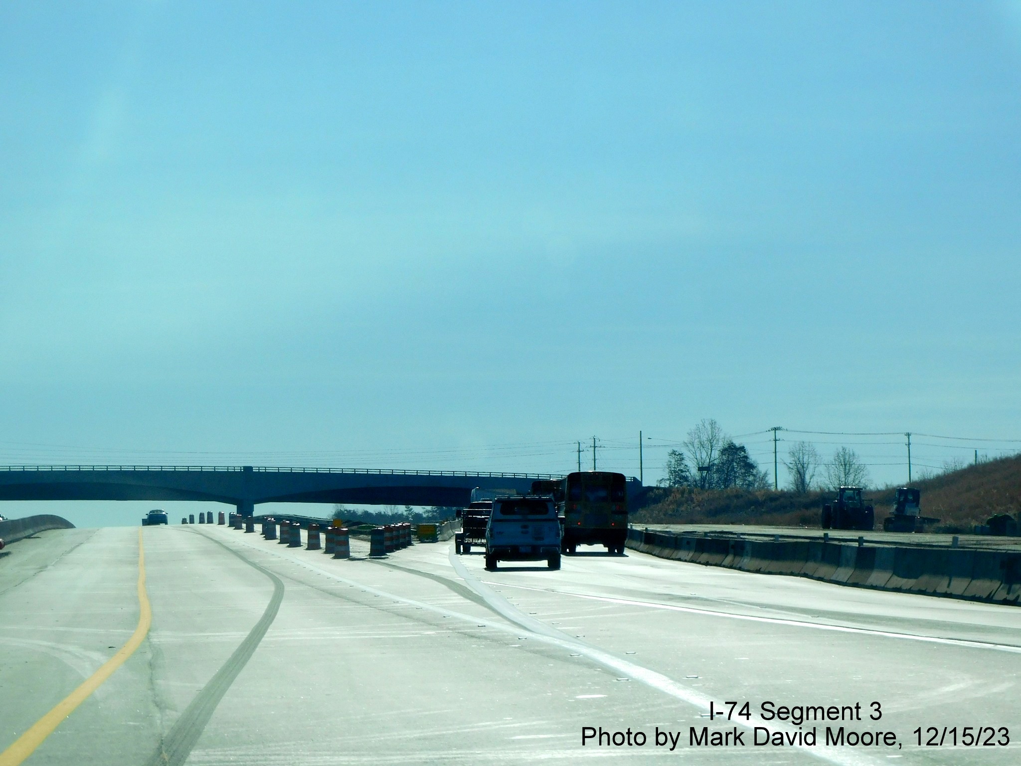 Image of temporary split between US 52 South lanes and NC 74 East Winston-Salem Northern Beltway 
        lanes prior to the NC 65 exit, by Mark David Moore, December 2023