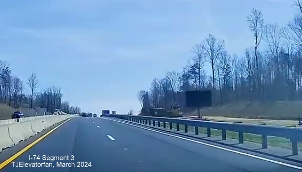 Dashcam video image of US 52 South showing the portable VMS still being used as an exit sign
        prior to the NC 65 exit, video by TJElevatorfan, posted March 16, 2024