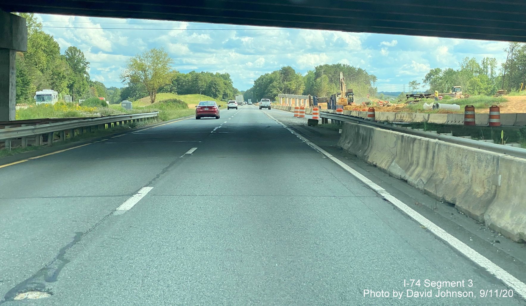 Image of driving under new NC 65 bridge over US 52, part of future I-74 Winston Salem Northern Beltway interchange construction, by David Johnson September 2020