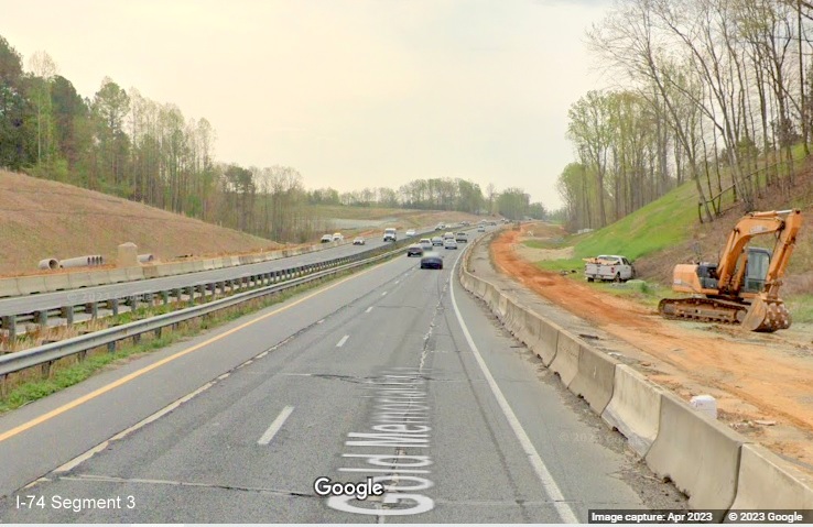Image of widening work construction zone for future I-74/Winston-Salem Beltway beyond Westinghouse 
        Road on US 52 South (Future I-74 East), Google Maps Street View, April 2023