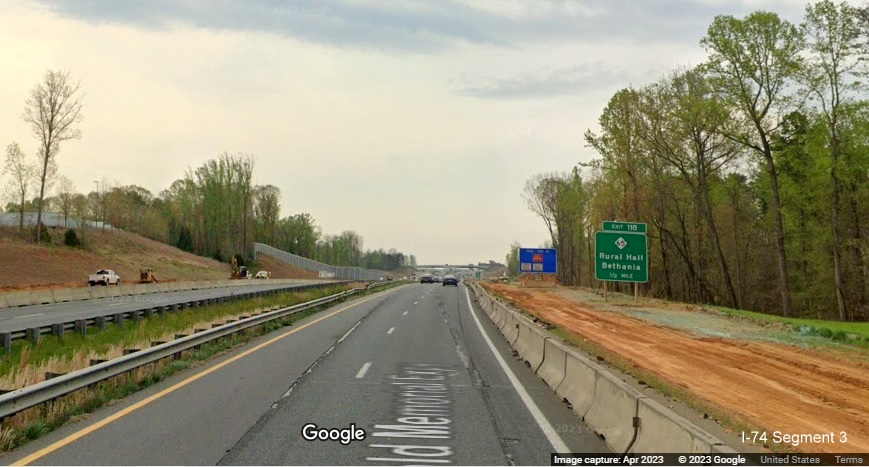 Image of 1/2 mile advance sign for NC 65 exit in construction zone for future I-74/Winston-Salem 
        Beltway on US 52 South (Future I-74 East), Google Maps Street View, April 2023