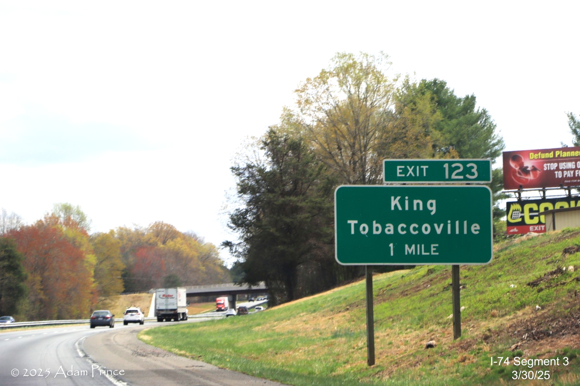 Image of ground mounted 1 mile advance sign for the King/Tobaccoville exit on 
		US 74 (Future I-74) East showing lack of new exit signing or new exit number by Adam Prince, March 2025