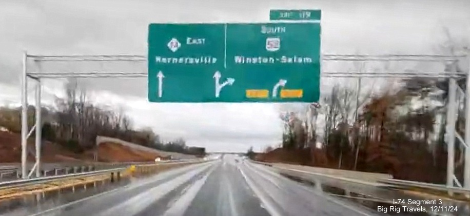 Image of newly placed overhead signs at ramp for US 52 South exit at beginning of NC 74
       (Future I-74) East in Rural Hall, screen grab from Big Rig Travels video, December 2024