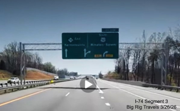 Image of still not renumbered overhead 1/4 mile advance sign for the US 52
	  South exit on US 52 South (Future I-74 East), screen grab from Big Rig Travels video, March 2026