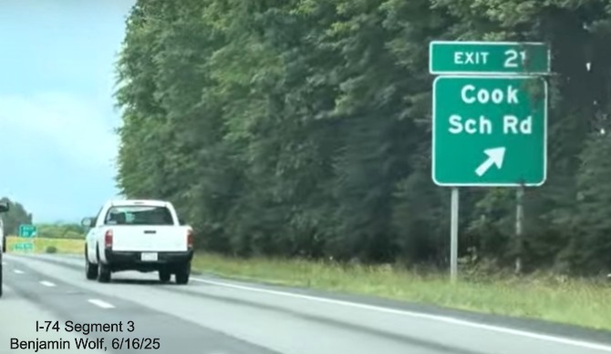 Image of renumbered exit sign for the Cook School Road exit in Mt. Airy on 
	  US 52 South (Future I-74 East), screen grab from Benjamin Wolf video, June 2025