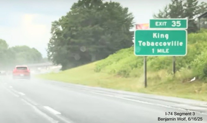 Image of renumbered 1 Mile advance sign for the King/Tobaccoville exit on 
	  US 52 South (Future I-74 East), screen grab from Benjamin Wolf video, June 2025