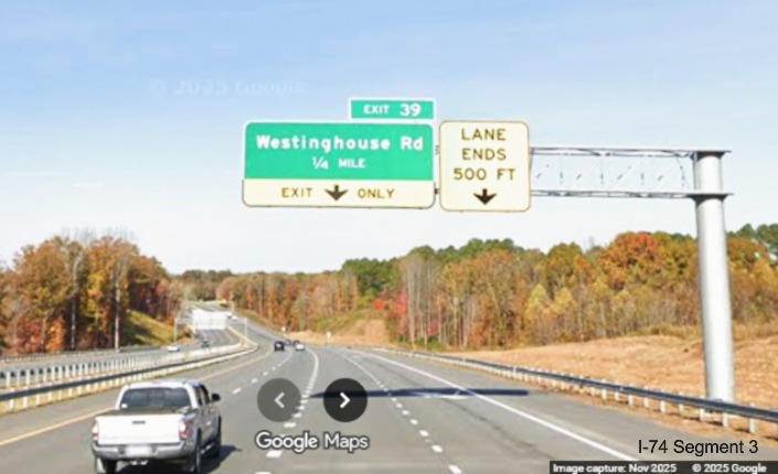 Image of renumbered overhead 1/4 mile advance sign for the Westinghouse
	  Road exit on US 52 North (Future I-74 West), Google Maps Street View, November 2025
