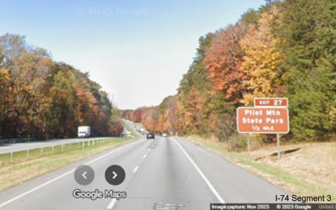 Image of renumbered ground mounted 1/2 Mile advance sign for Pilot Mountain State
	  Park exit on US 52 North (Future I-74 West), Google Maps Street View, November 2025