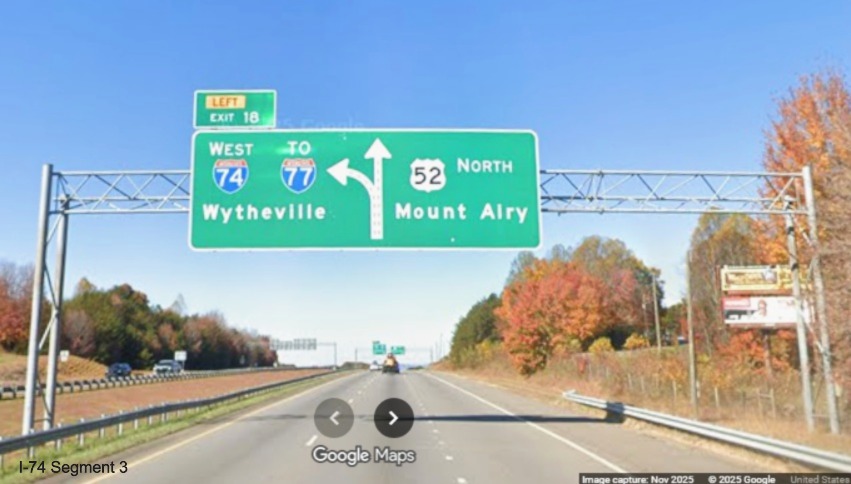 Image of renumbered overhead digrammatic 1/2 mile advance sign for the I-74 West
	  exit on US 52 North (Future I-74 West), Google Maps Street View, November 2025