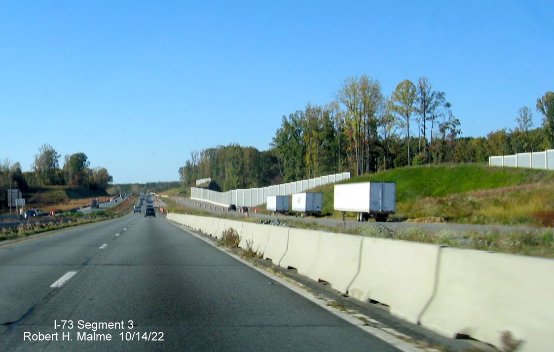 Image of US 52 North roadway approaching merge with NC 65 exit in I-74/Winston-Salem Northern Beltway 
        interchange construction zone in Rural Hall, October 2022