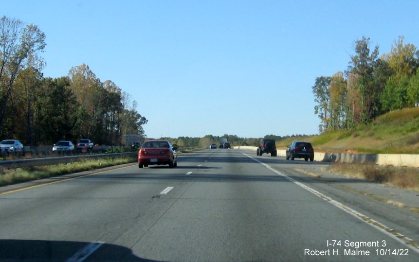 Image of US 52 North lanes being widened at merge with the NC 65 exit aa part of the project buildign the future 
       I-74/Winston-Salem Northern Beltway interchange in Rural Hall, October 2022