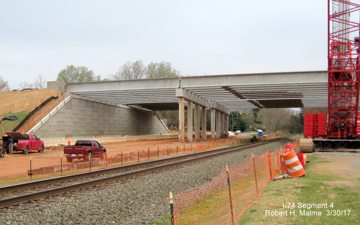 Image of view along railroad tracks of new bridge being constructed for I-74/Beltway over W. Mountain St. in Winston-Salem