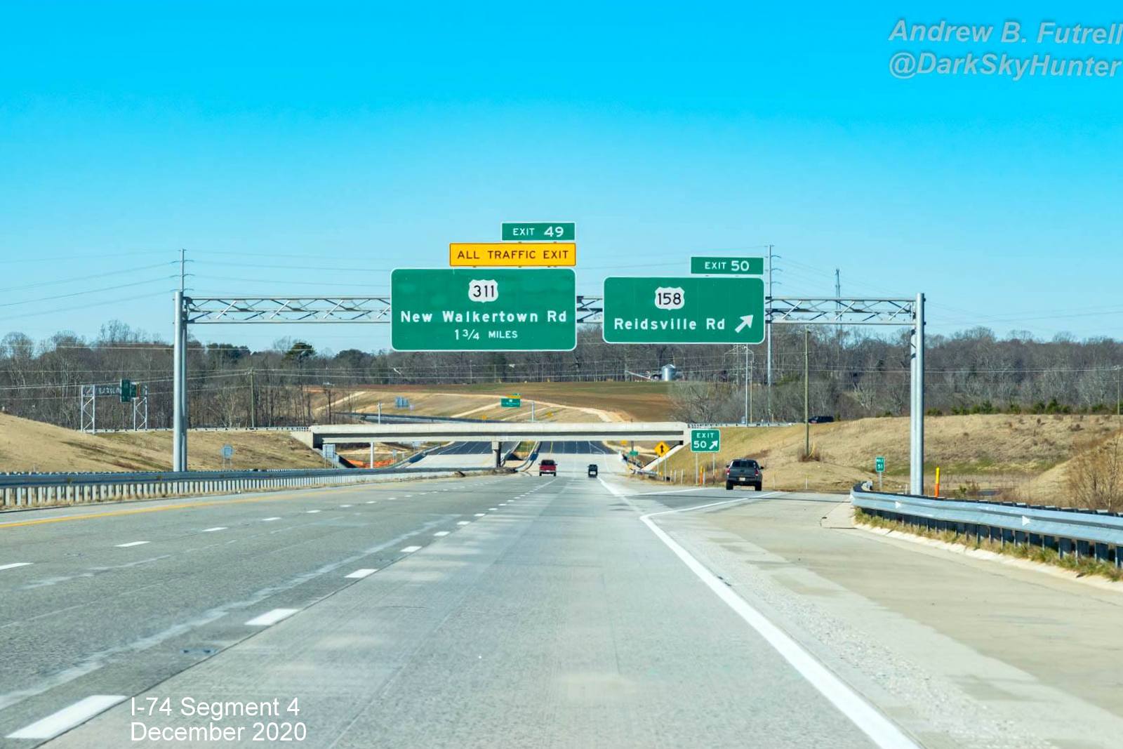 Image of overhead signs for newly opened section of NC 74 (Future I-74) West Winston-Salem Northern 
        Beltway, by Andrew F. Futrell, December 2020