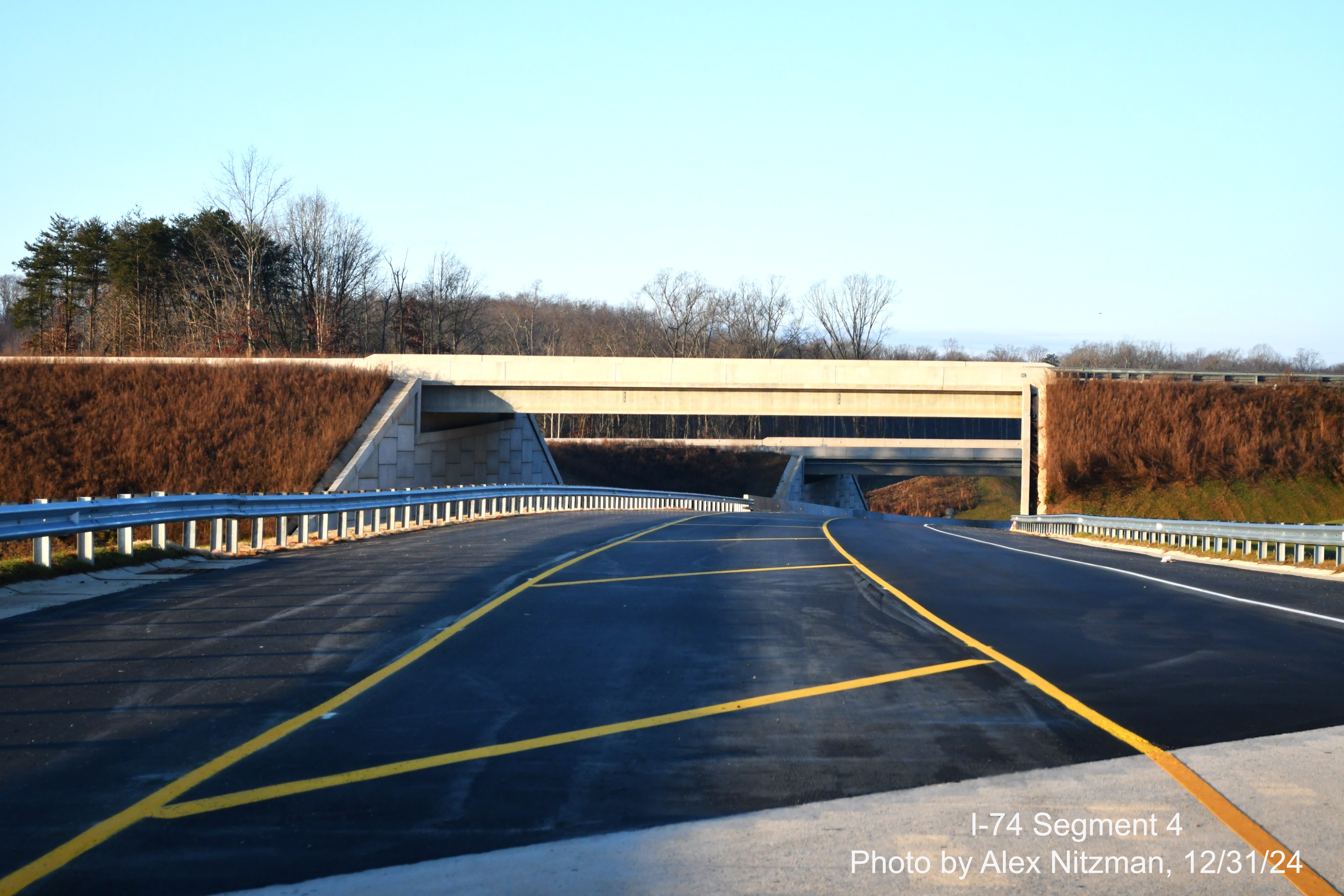 Image of recently opened NC 74 West/Winston-Salem Northern Beltway ramp to US 52 South
      heading under US 52 bridges, December 2024, Alex Nitzman