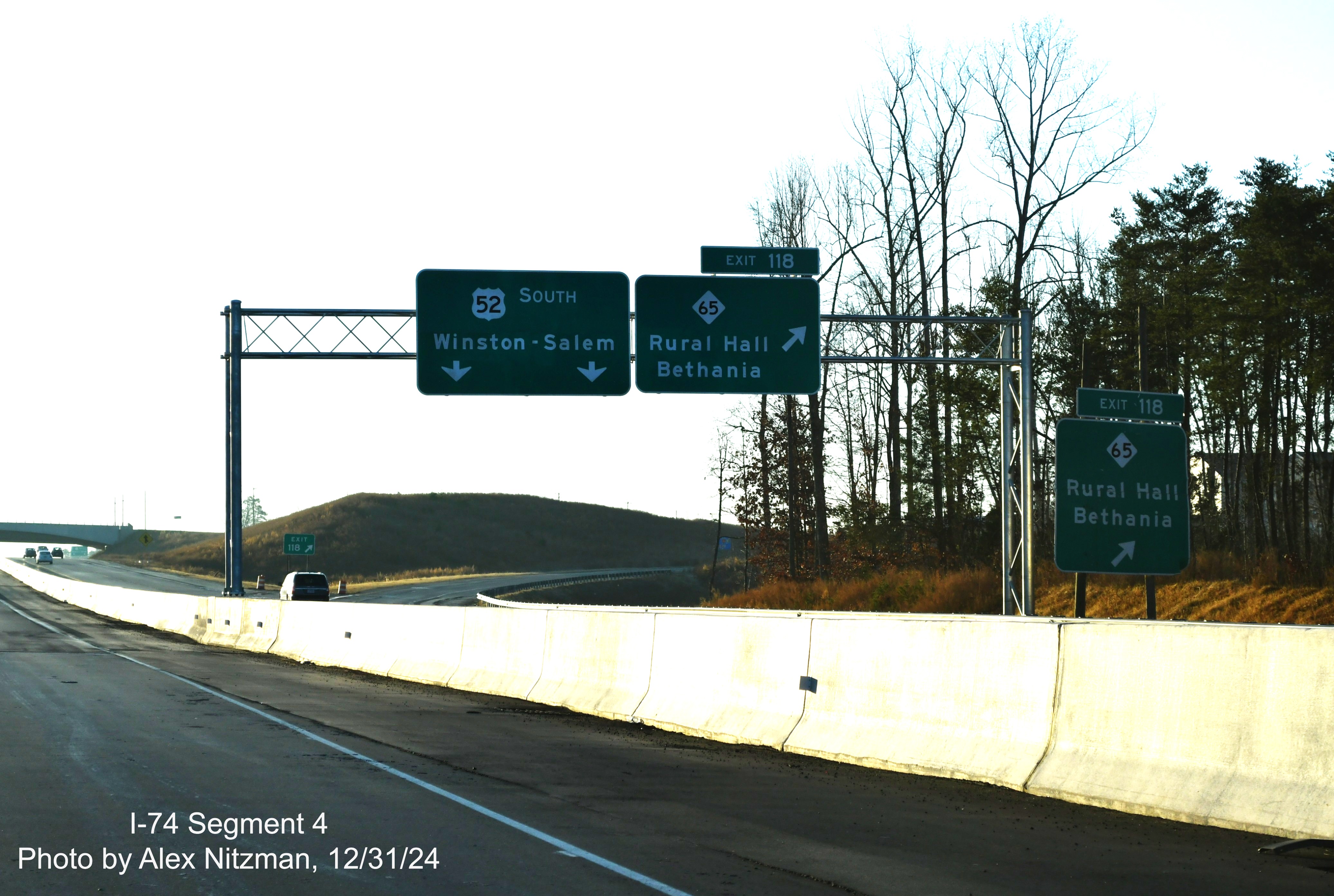 Image of overhead signage at NC 65 exit on US 52 South after ramp from NC 74 East/
	  Winston-Salem Northern Beltway, December 2024, Alex Nitzman