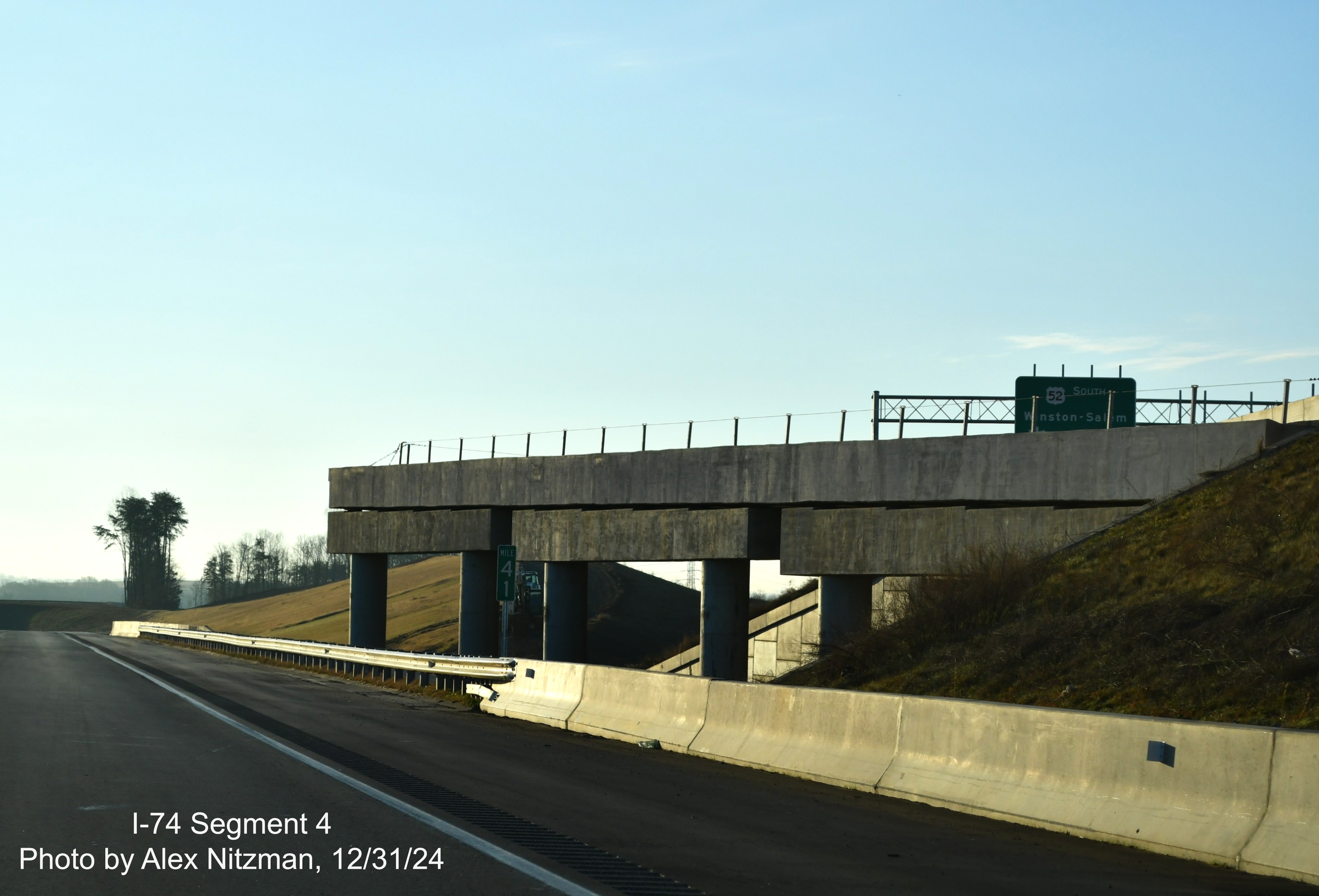 Image of NC 74 East/Winston-Salem Northern Beltway passing bridge structure on
	  US 52 South, December 2024, Alex Nitzman