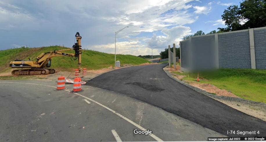 Image looking from Baux Mountain Road roundabout toward future on-
          ramp to unopened Winston-Salem Northern Beltway / NC 74 (Future I-74) West, Google Maps Street View, July 2022