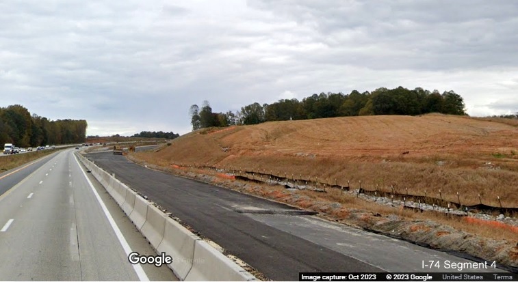 Image of construction between paved future ramps to I-74/Winston-Salem Northern Beltway from I-40 East 
        in Forsyth County, Google Maps Street View, October 2023