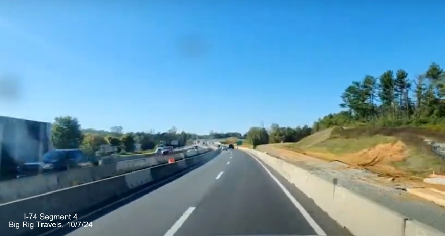 Screen grab of video showing lack of paving still on future ramp from US 52 North to NC 74
       (Future I-74) East/Winston-Salem Northern Beltway, Big Rig Travels, October 2024