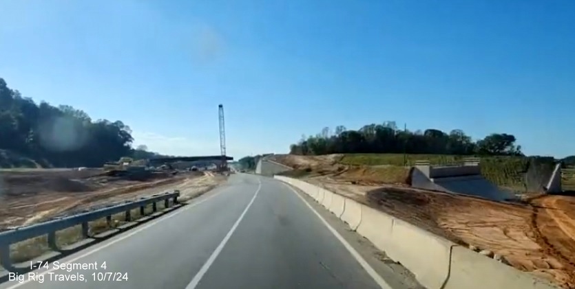 Image of ramp bridge abutments being constructed in Winston-Salem Northern Beltway work area 
        on I-74 West, screen grab of Big Rig Travels video, October 2024