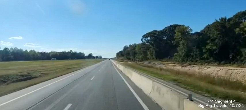 Image of site of future ramp from Winston-Salem Northern Beltway to current I-74 West, screen 
        grab of Big Rig Travels video, October 2024