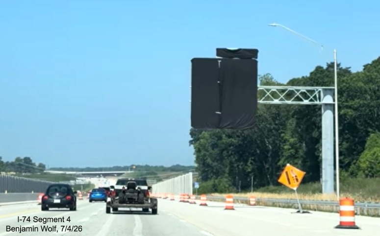Image of covered up 1 mile advance sign for the I-74/Beltway exit on I-40 West 
	 after the Union Cross Road exit, screen grab from Benjamin Wolf video, July 4, 2026