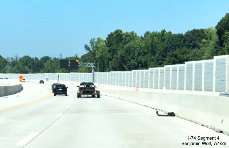 Image of concrete barrier still installed along new I-40 West lanes after the
	 Beltway interchange, screen grab from Benjamin Wolf video, July 4, 2026