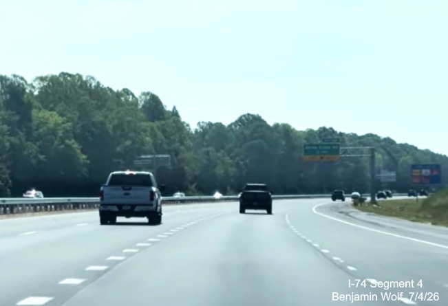 Image of NC 192 East lanes merging with those from future I-74 West. Notice the 
	 lane markings have been placed for the Beltway lanes, screen grab from Benjamin Wolf video, July 4, 2026