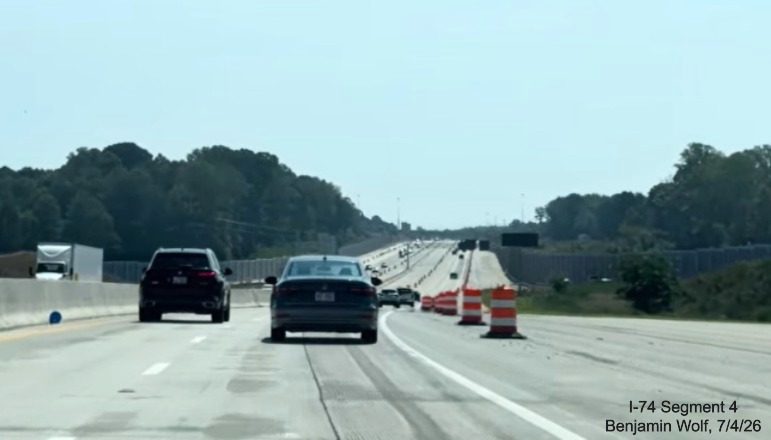 Image of I-40 East roadway after the I-74/Winston-Salem Northern Beltway
	 flyover ramps, showing lane striping is still needed, screen grab from Benjamin Wolf video, July 4, 2026