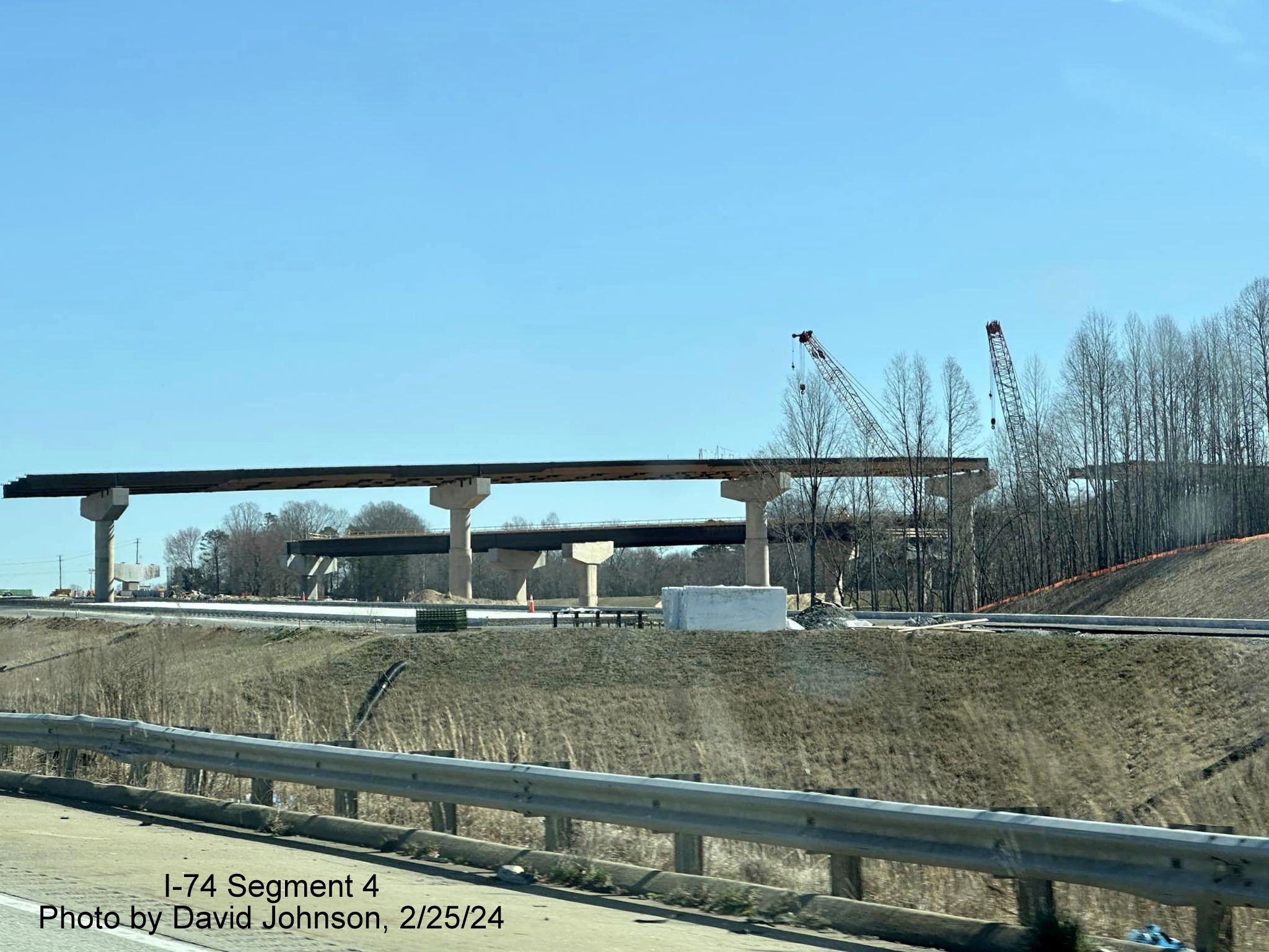 Image of work proceeding on building the future flyover ramps to I-74/Winston-Salem Northern 
        Beltway from I-40 East in Forsyth County, by David Johnson, February 2024