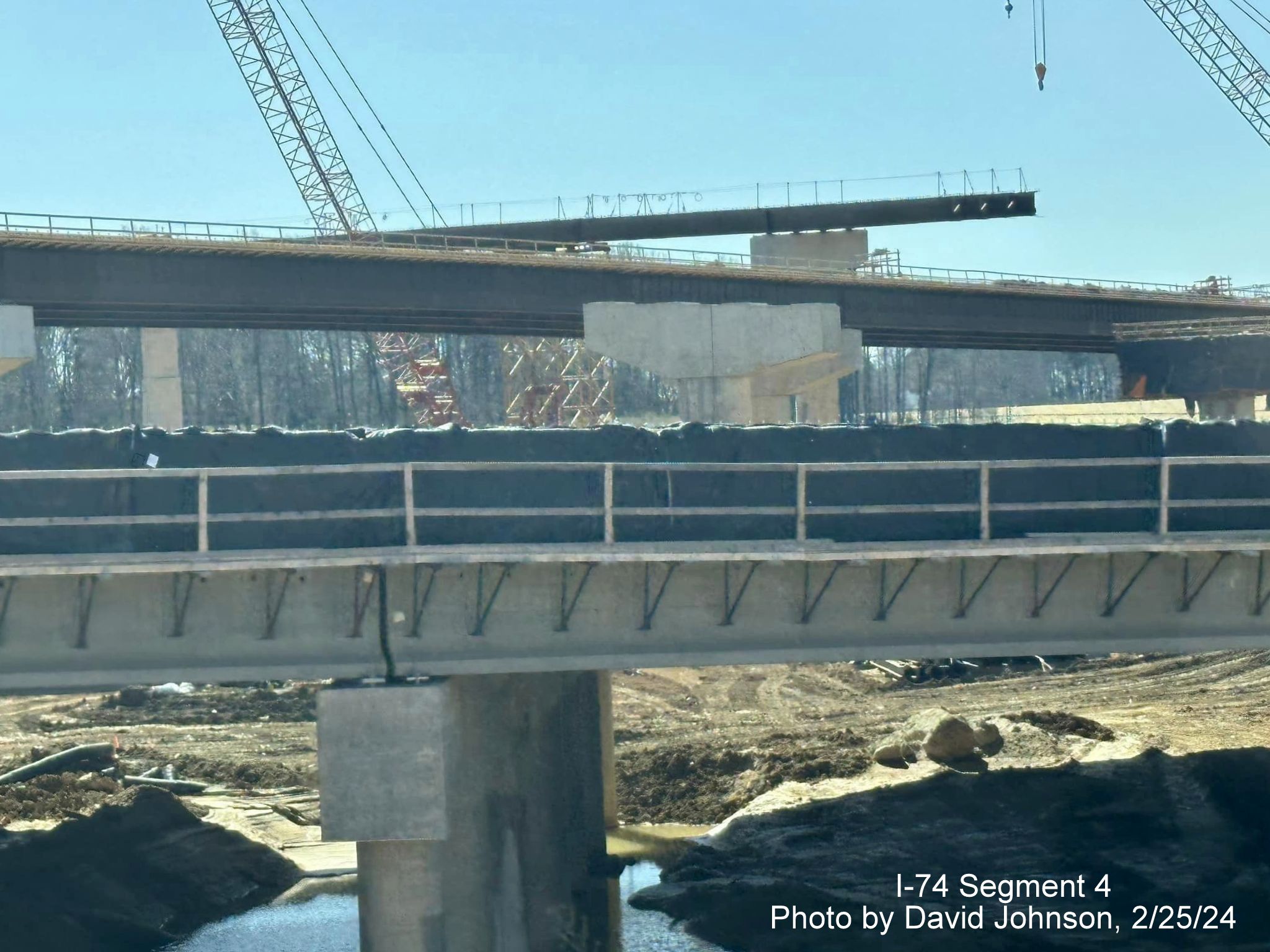 Image of future I-40 bridge and flyover ramps under construction as part of I-74/Winston-Salem 
        Northern Beltway construction from current I-40 East in Forsyth County, by David Johnson, February 2024