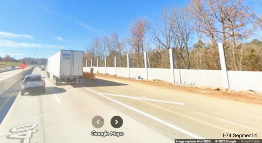 Image of noise wall still under construction along future I-40 West lanes in I-74 
	  Winston-Salem Northern Beltway interchange construction zone, Google Maps Street View, November 2025