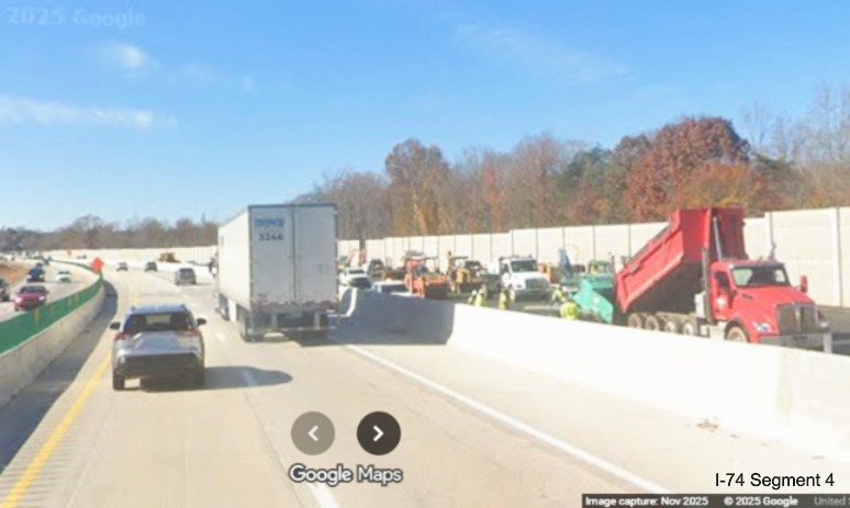 Image of vehicles in future I-40 West lanes passing completed section of noise
	  wall in I-74 Winston-Salem Northern Beltway interchange construction zone, Google Maps Street View, November 2025
