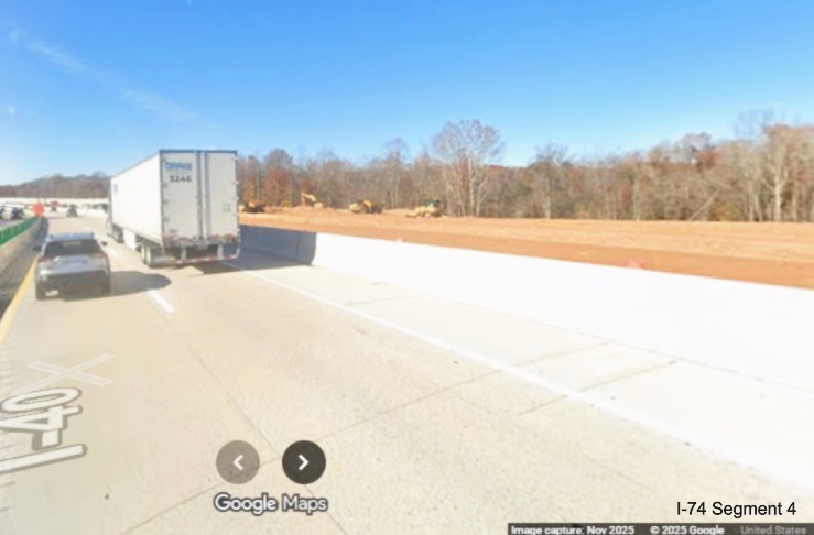 Image of current Future I-40 West lanes passing future permanent lanes in I-74 
	  Winston-Salem Northern Beltway interchange construction zone, Google Maps Street View, November 2025