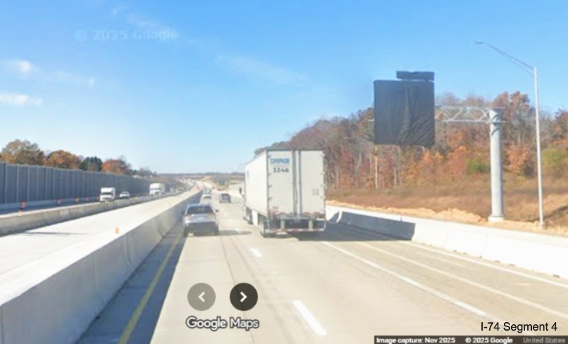 Image of Future I-74 advance sign covered up along I-40 West after the Union Cross
	  Road exit ramp, Google Maps Street View, November 2025