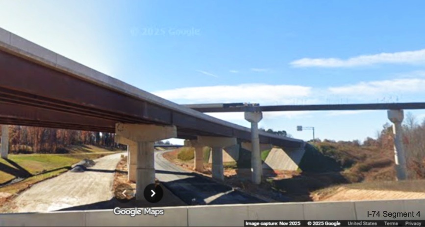 Image of Future I-40 West to I-74 East flyover ramp under construction from 
	  current I-40 West lanes, Google Maps Street View, November 2025