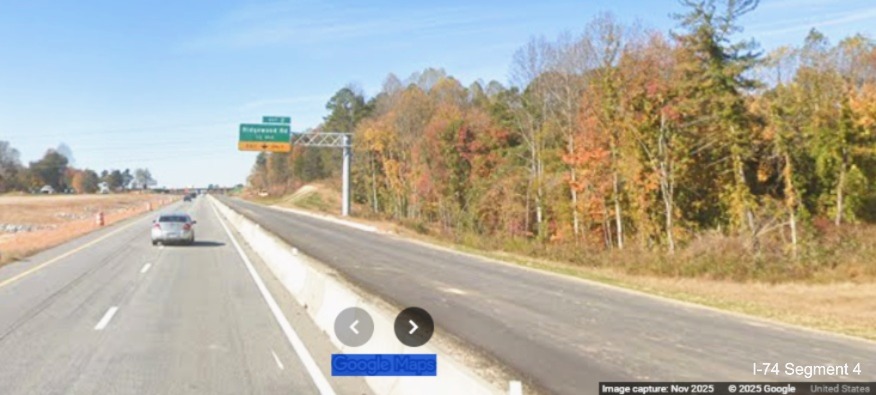 Image of current I-74 West traffic approaching exit to Ridgewood Road after 
	  merge from future ramp from I-74 East/Winston-Salem Northern Beltway, Google Maps Street View, November 2025