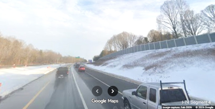 Image of completed I-74 East lanes and noise walls alongside as part of the 
	  Winston- Salem Northern Beltway interchange project, screen grab from Google Maps Street View, February 2026
