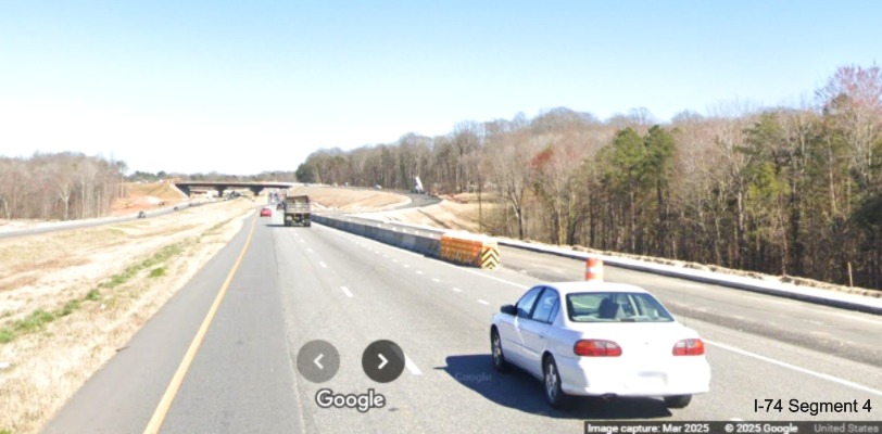 Image of partially paved future on-ramp to the westbound
	  Winston-Salem Northern Beltway interchange on I-74 East, Google Maps Street View, March 2025