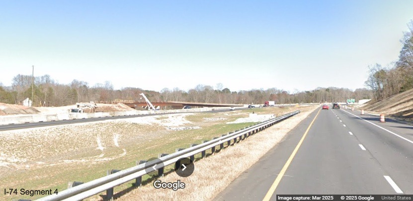 Image of westbound ramps under construction across the median from I-74 East in the
	  Winston-Salem Northern Beltway interchange work zone on I-74 East, Google Maps Street View, March 2025