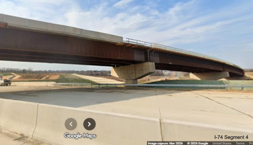 Image looking across future I-40 West lanes at flyover ramp bridge from I-40 East
	 to the I-74 West Beltway in the Winston-Salem Northern Beltway interchange work zone, screen grab from Google Maps Street View,
	 March 2026